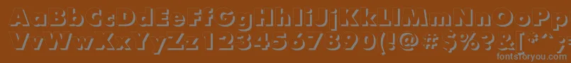 FuturisxshadowcttRegular-fontti – harmaat kirjasimet ruskealla taustalla