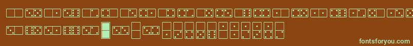 フォントWhitedominoes – 緑色の文字が茶色の背景にあります。
