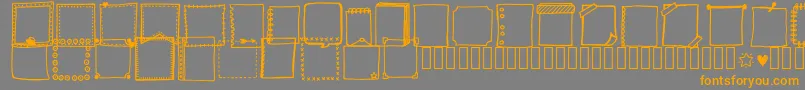 Czcionka Tanaesteldoodleframes01Regular – pomarańczowe czcionki na szarym tle