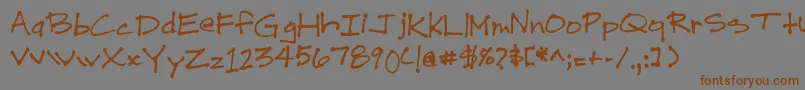 フォントDrewHand1 – 茶色の文字が灰色の背景にあります。