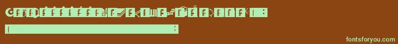 フォントDbaMuslim – 緑色の文字が茶色の背景にあります。