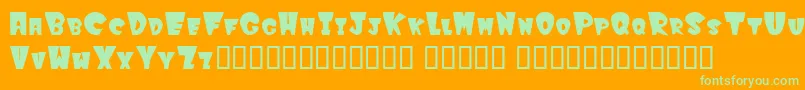 Winks-Schriftart – Grüne Schriften auf orangefarbenem Hintergrund