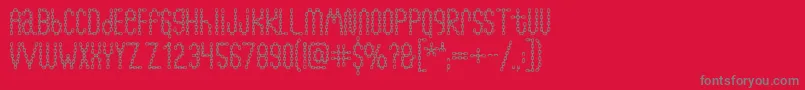 Chainfontblack-Schriftart – Graue Schriften auf rotem Hintergrund