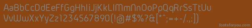 Czcionka GidolinyaRegular – szare czcionki na brązowym tle