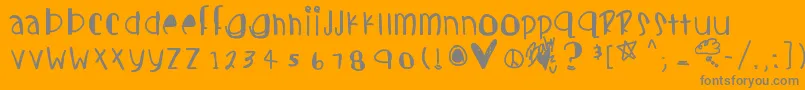 Candycutes-fontti – harmaat kirjasimet oranssilla taustalla