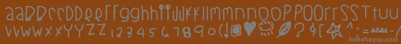 Blackberrybluesthick-fontti – harmaat kirjasimet ruskealla taustalla