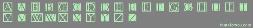 Czcionka Tornielloinitials – zielone czcionki na szarym tle