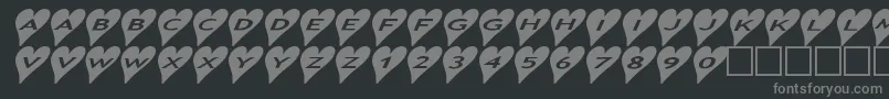 Ashearts2a-fontti – harmaat kirjasimet mustalla taustalla