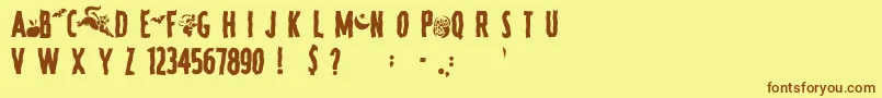 フォントSpookyRegular – 茶色の文字が黄色の背景にあります。