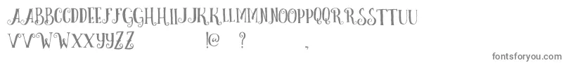 CurelyFreeTypeface-fontti – harmaat kirjasimet valkoisella taustalla