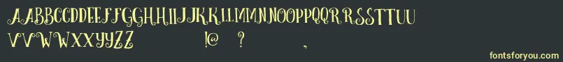 Шрифт CurelyFreeTypeface – жёлтые шрифты на чёрном фоне