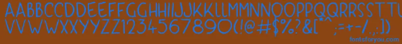 KyriKaps Font – Blue Fonts on Brown Background