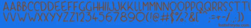 フォントKyriKaps – 茶色の文字が青い背景にあります。