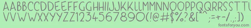 フォントKyriKaps – 緑の背景に灰色の文字