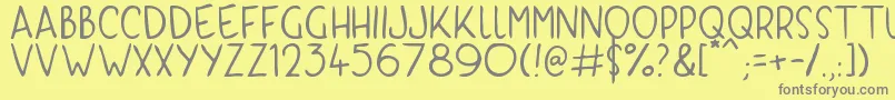 KyriKaps Font – Gray Fonts on Yellow Background