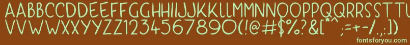 フォントKyriKaps – 緑色の文字が茶色の背景にあります。