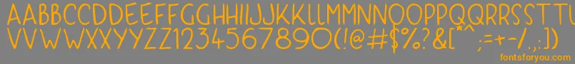 フォントKyriKaps – オレンジの文字は灰色の背景にあります。