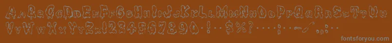Ghoulycaps-fontti – harmaat kirjasimet ruskealla taustalla