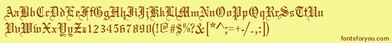 フォントOldeenglish – 茶色の文字が黄色の背景にあります。