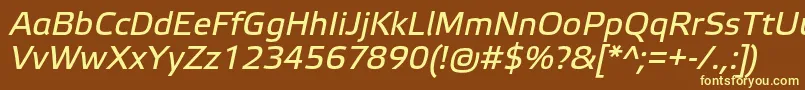 ElektraTextProItalic-fontti – keltaiset fontit ruskealla taustalla