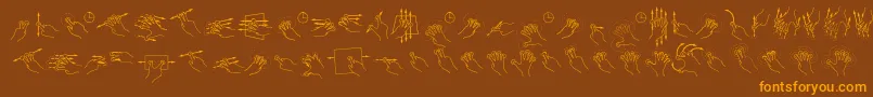 Czcionka GestureGlyphs – pomarańczowe czcionki na brązowym tle