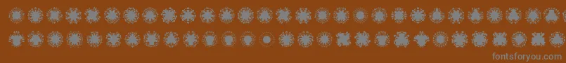 Ovulinu-Schriftart – Graue Schriften auf braunem Hintergrund