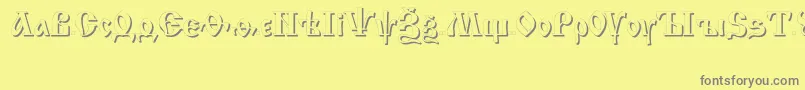 フォントIzhitsa ffy – 黄色の背景に灰色の文字