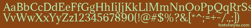 フォントAdaminaRegular – 緑色の文字が茶色の背景にあります。