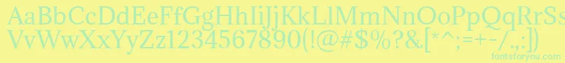 フォントAdaminaRegular – 黄色い背景に緑の文字