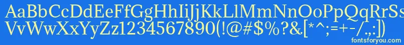 AdaminaRegular Font – Yellow Fonts on Blue Background