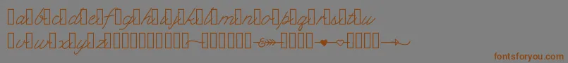 フォントKlcupid – 茶色の文字が灰色の背景にあります。