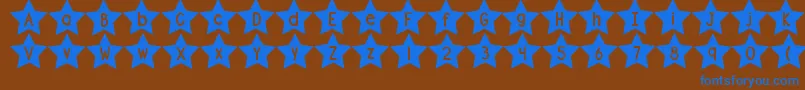 Fonte DjbShapeUpStars – fontes azuis em um fundo marrom