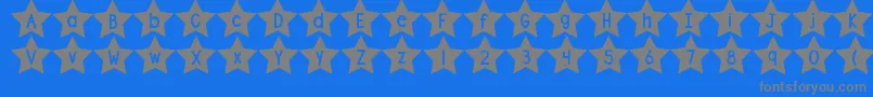 DjbShapeUpStars-fontti – harmaat kirjasimet sinisellä taustalla