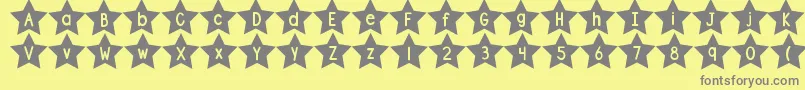 DjbShapeUpStars-fontti – harmaat kirjasimet keltaisella taustalla