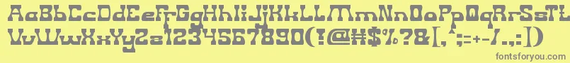 フォントGodIsWatchingUs – 黄色の背景に灰色の文字