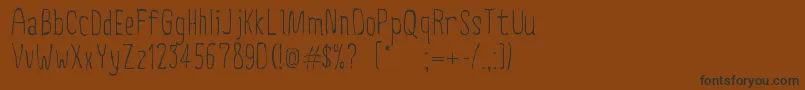 CreepyCircus Font – Black Fonts on Brown Background