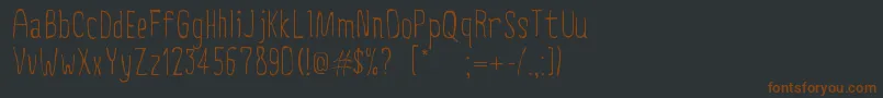 CreepyCircus Font – Brown Fonts on Black Background