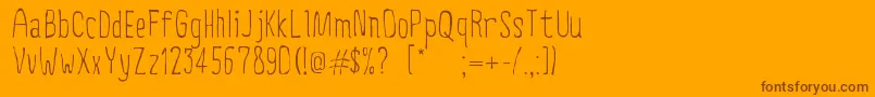 CreepyCircus Font – Brown Fonts on Orange Background