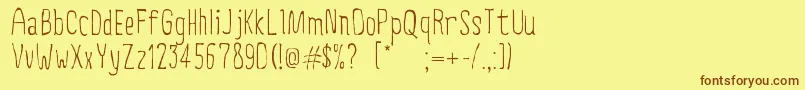CreepyCircus Font – Brown Fonts on Yellow Background