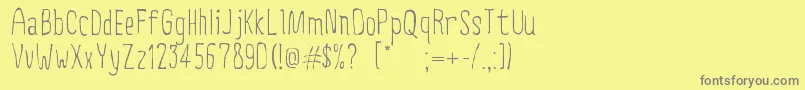 CreepyCircus Font – Gray Fonts on Yellow Background
