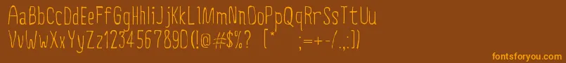 CreepyCircus Font – Orange Fonts on Brown Background