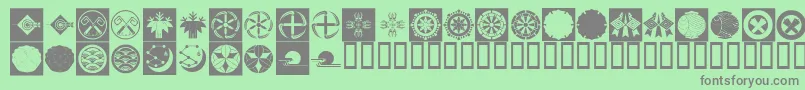 OrientPatternDingsSet4 Font – Gray Fonts on Green Background