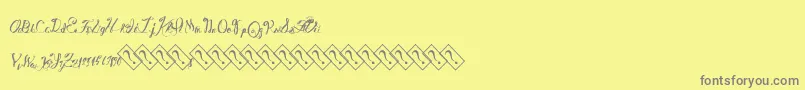 フォントWinebasement – 黄色の背景に灰色の文字