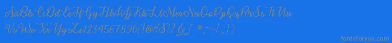 Fonte SnowflakeCalligraphyOtf – fontes cinzas em um fundo azul