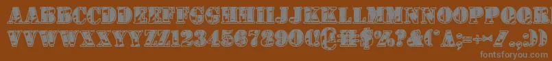 1stcav2-fontti – harmaat kirjasimet ruskealla taustalla