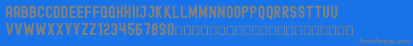 EdmundFree-fontti – harmaat kirjasimet sinisellä taustalla