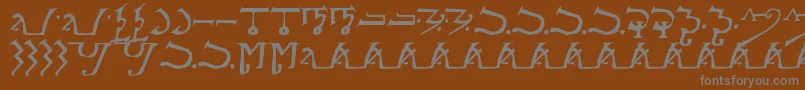 フォントAlpmagi – 茶色の背景に灰色の文字