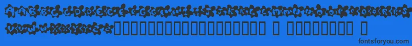 FriedEggsSmallcaps-Schriftart – Schwarze Schriften auf blauem Hintergrund