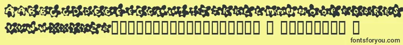 FriedEggsSmallcaps Font – Black Fonts on Yellow Background