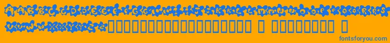 FriedEggsSmallcaps-Schriftart – Blaue Schriften auf orangefarbenem Hintergrund